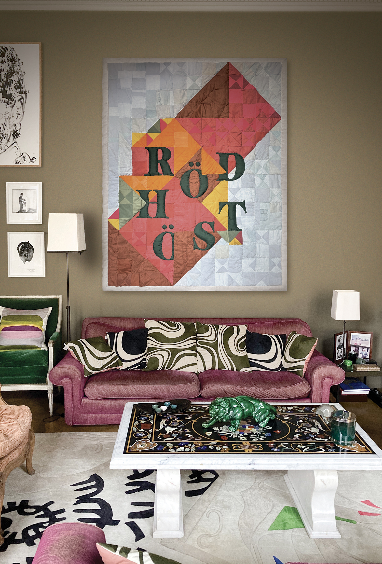 Hanging patchwork wall piece in shades of pink, orange, yellow, green, light blue and brown displayed in an apartment – contemporary textile art by Pénélope Westberg