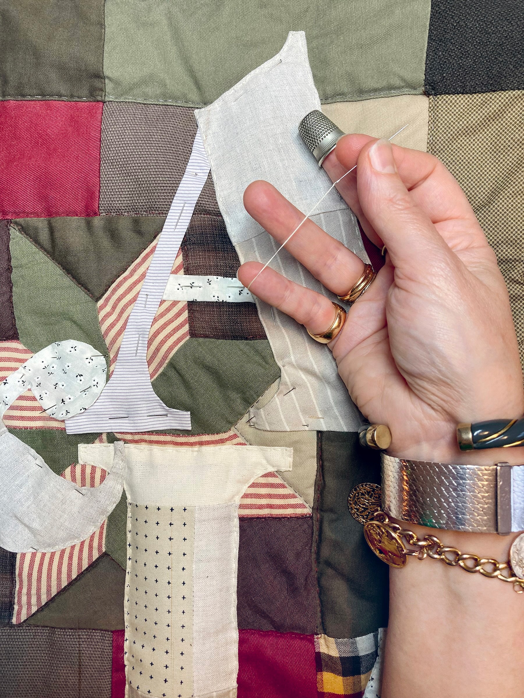 Close-up of hand-stitched appliqué lettering – custom textile art by Pénélope Westberg